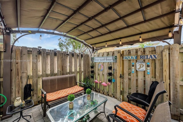 view of patio / terrace featuring outdoor dining area and fence