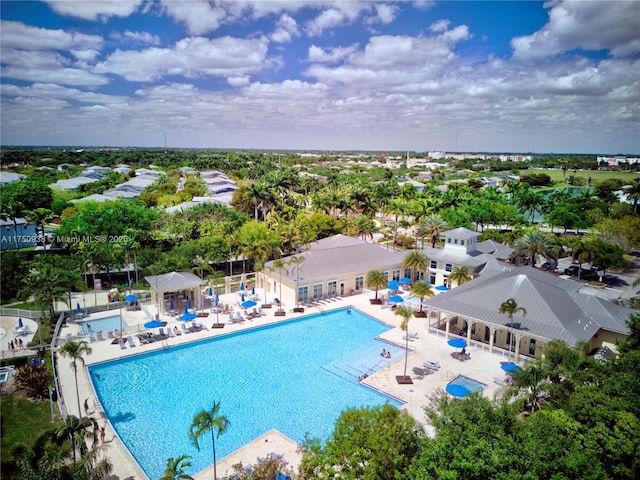 community pool featuring a patio and fence