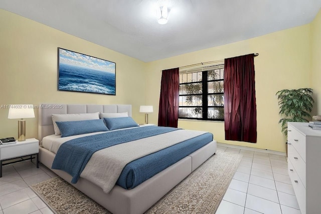 bedroom with light tile patterned floors