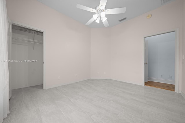 unfurnished bedroom featuring a ceiling fan, visible vents, and baseboards