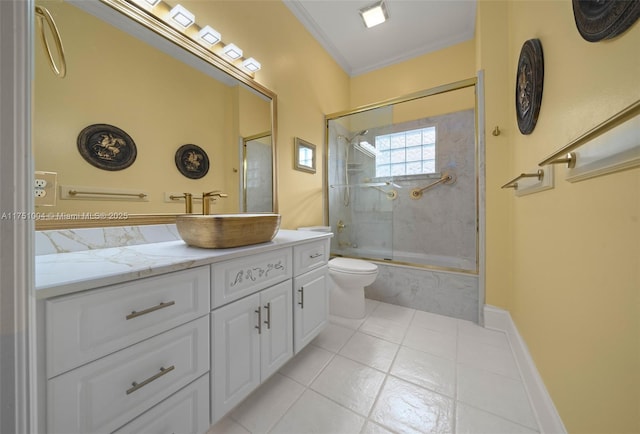 bathroom with toilet, a combined bath / shower with marble appearance, vanity, baseboards, and ornamental molding