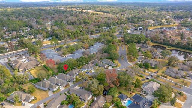 bird's eye view featuring a water view and a residential view