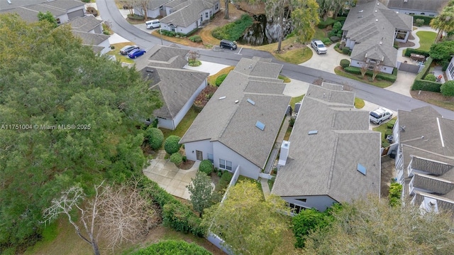 birds eye view of property with a residential view