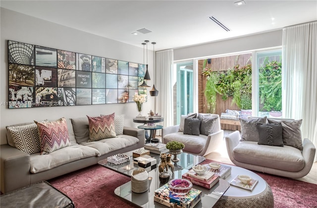 living room featuring visible vents