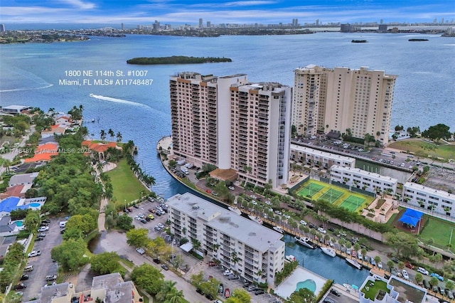 birds eye view of property featuring a view of city and a water view