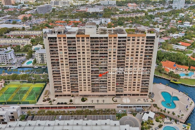 drone / aerial view featuring a water view and a view of city