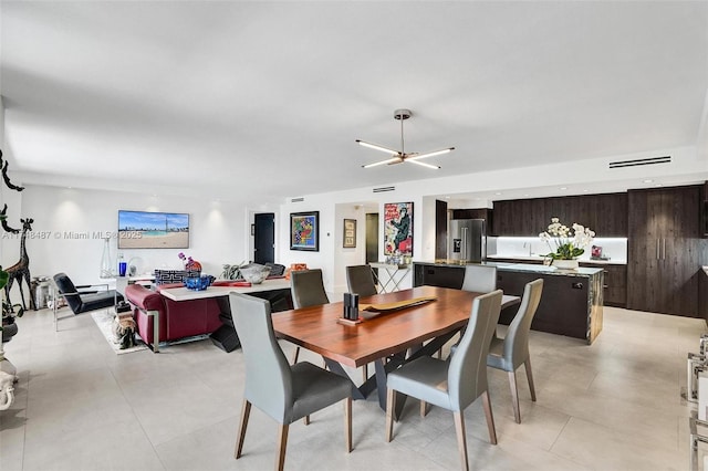 dining room featuring light tile patterned flooring and recessed lighting