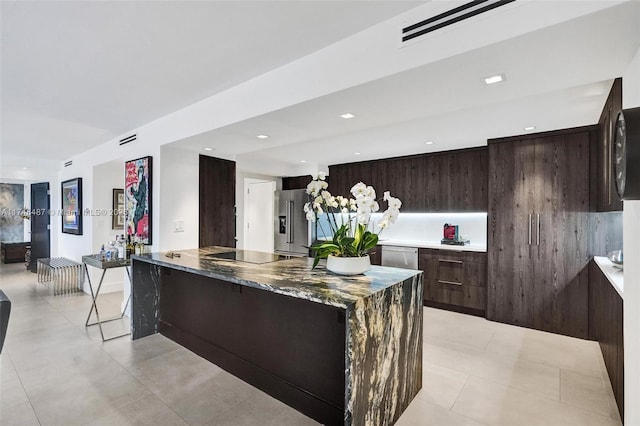 kitchen featuring stainless steel appliances, recessed lighting, visible vents, light tile patterned flooring, and modern cabinets