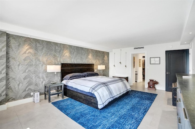 bedroom featuring baseboards, an accent wall, recessed lighting, and wallpapered walls