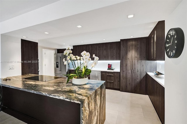 kitchen with light tile patterned flooring, dark brown cabinetry, recessed lighting, appliances with stainless steel finishes, and modern cabinets