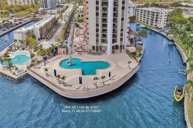 drone / aerial view with a view of city and a water view