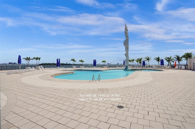 community pool with a patio