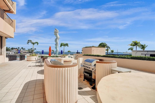 view of patio featuring a water view