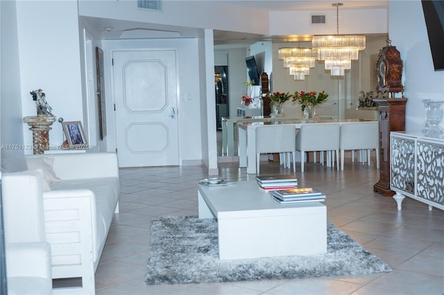 living area featuring a chandelier, visible vents, and light tile patterned floors