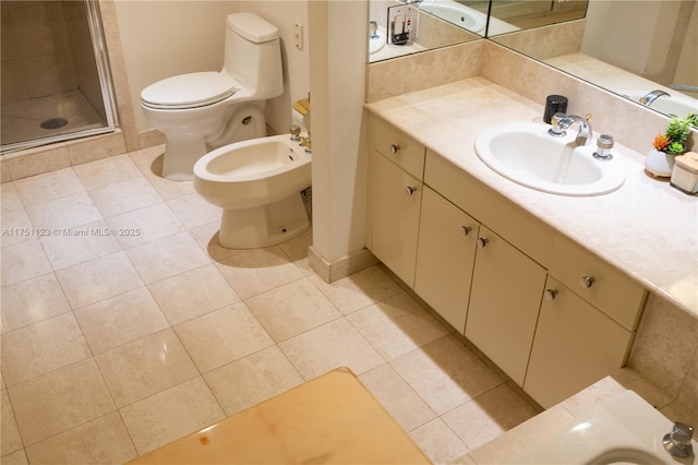 full bath with toilet, vanity, a bidet, and tile patterned floors