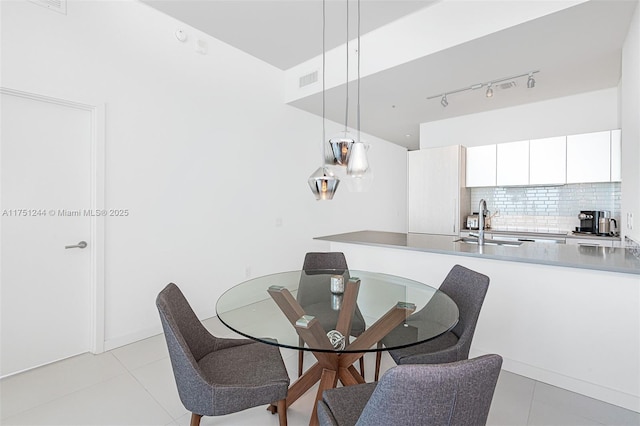 dining space featuring visible vents and light tile patterned floors