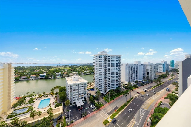 drone / aerial view featuring a water view and a city view