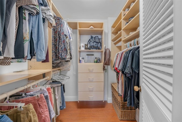 spacious closet with light wood finished floors