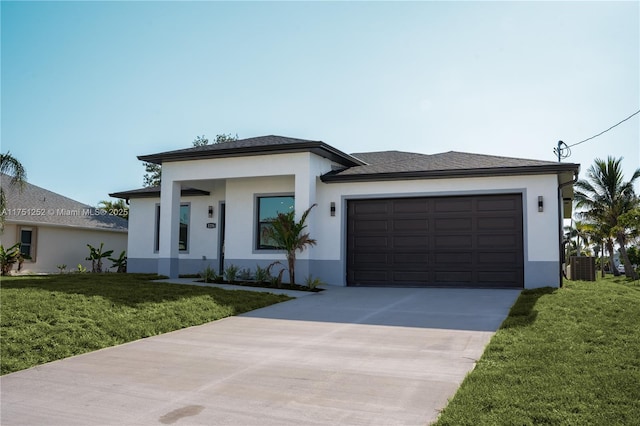 prairie-style home with driveway, a front lawn, an attached garage, and stucco siding