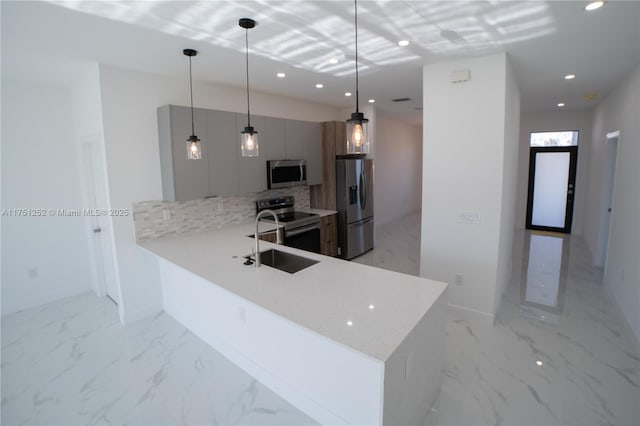 kitchen with modern cabinets, appliances with stainless steel finishes, a peninsula, marble finish floor, and gray cabinets