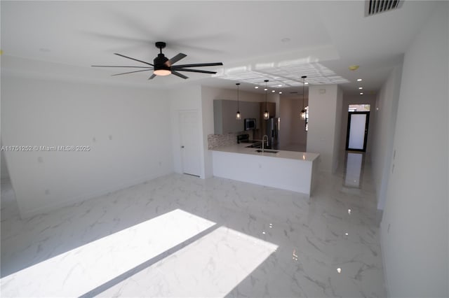 unfurnished living room with recessed lighting, a sink, visible vents, a ceiling fan, and marble finish floor