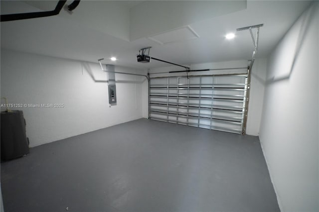 garage with electric panel and a garage door opener