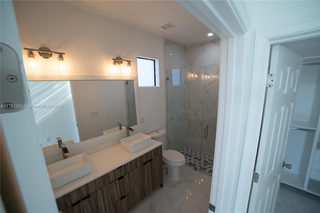 bathroom with marble finish floor, visible vents, a sink, and double vanity