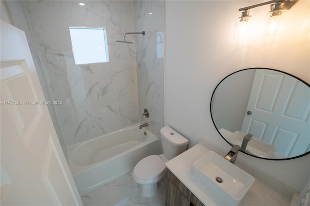 bathroom with toilet, marble finish floor, vanity, and washtub / shower combination