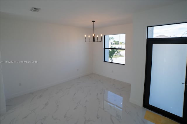 empty room with baseboards, marble finish floor, visible vents, and a notable chandelier