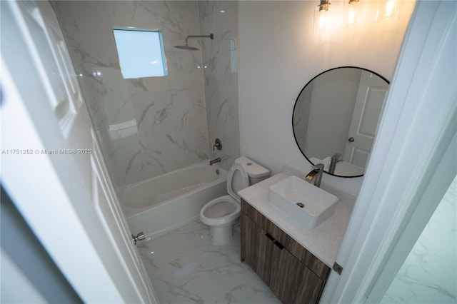 full bathroom featuring toilet, marble finish floor,  shower combination, and vanity