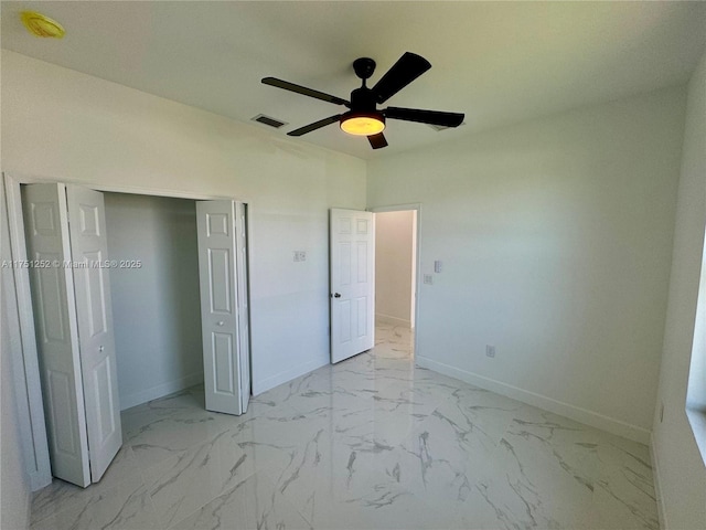 unfurnished bedroom with marble finish floor, baseboards, and visible vents