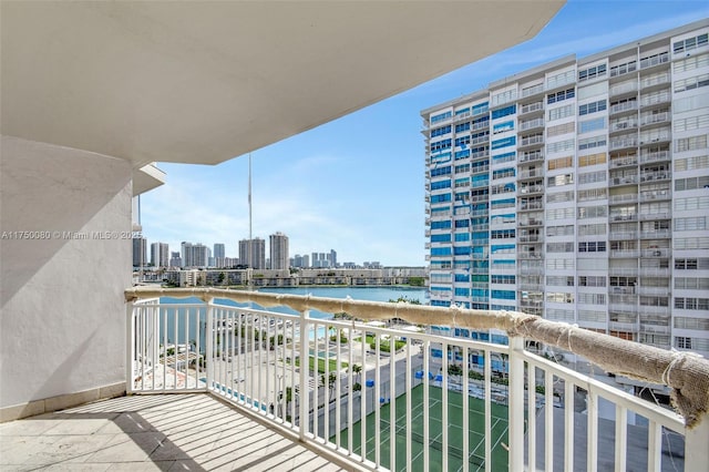 balcony featuring a water view and a view of city