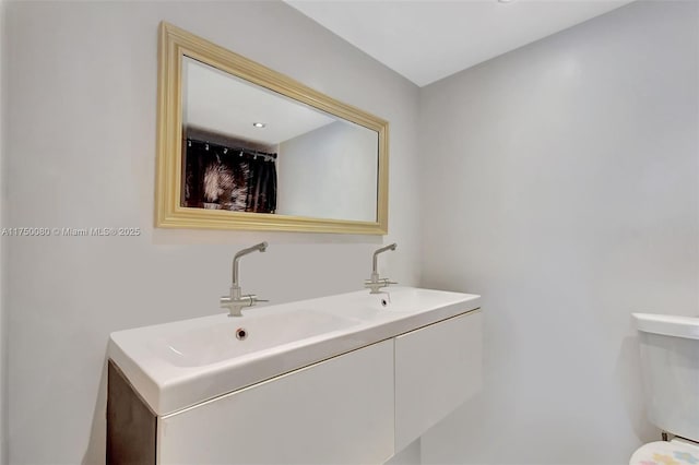 bathroom featuring double vanity and a sink