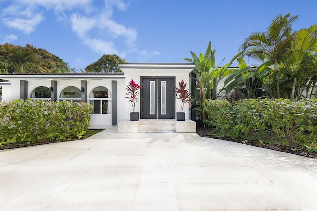 1651 SW 13th Ave, Miami, FL 33145 - entrance to property with stucco siding