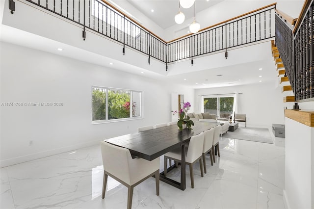 1651 SW 13th Ave, Miami, FL 33145 - dining room with a towering ceiling, light marble finish floors, baseboards, stairs, and recessed lighting