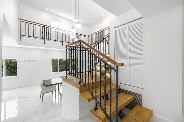 1651 SW 13th Ave, Miami, FL 33145 - stairway featuring a high ceiling, baseboards, marble finish floor, and a wealth of natural light