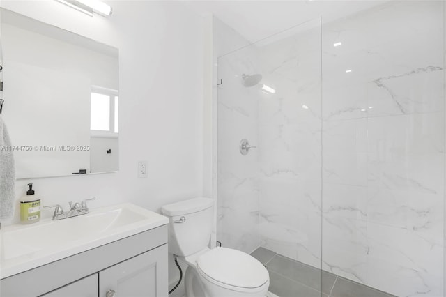 1651 SW 13th Ave, Miami, FL 33145 - full bathroom featuring vanity, toilet, and a marble finish shower