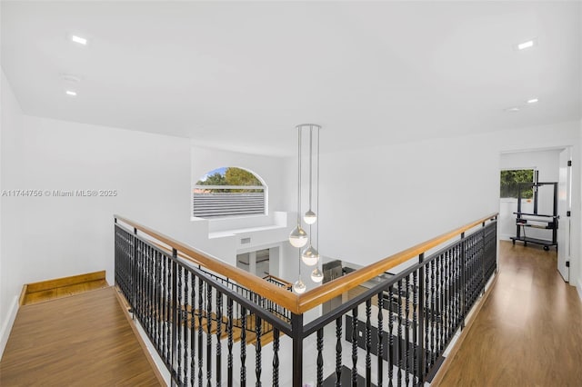 1651 SW 13th Ave, Miami, FL 33145 - hallway featuring wood finished floors, an upstairs landing, and baseboards