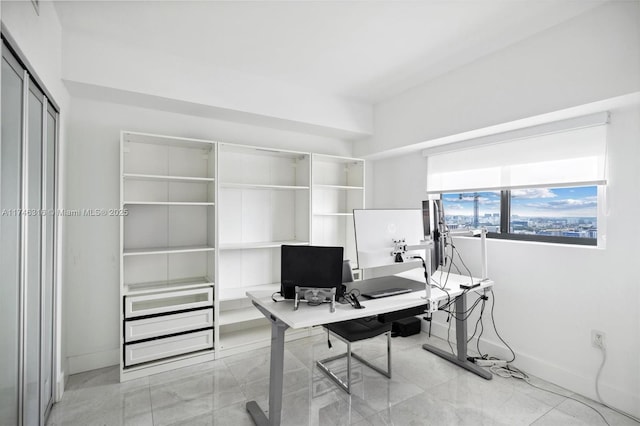 office area featuring baseboards