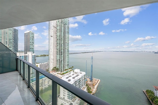 balcony with a view of city and a water view