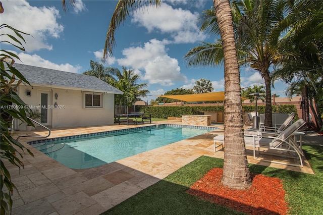 view of pool with fence, a fenced in pool, and a patio