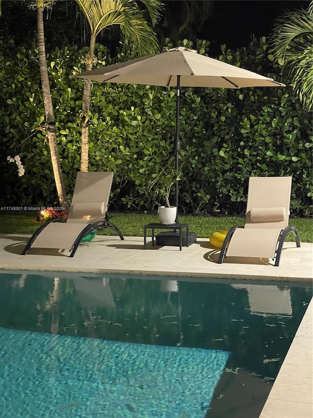 outdoor pool featuring a patio
