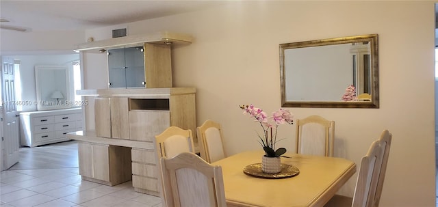 dining space with visible vents and light tile patterned floors