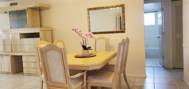 dining area with visible vents and light tile patterned flooring