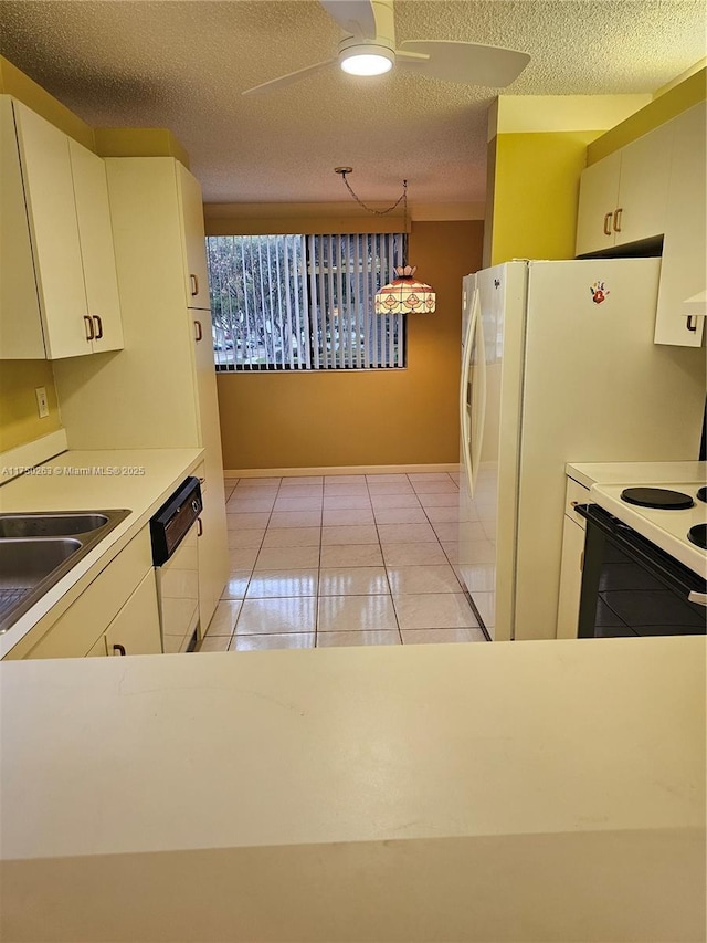 kitchen with ceiling fan, white dishwasher, a sink, hanging light fixtures, and light countertops