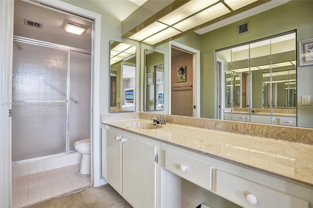 full bathroom with a stall shower, visible vents, and toilet