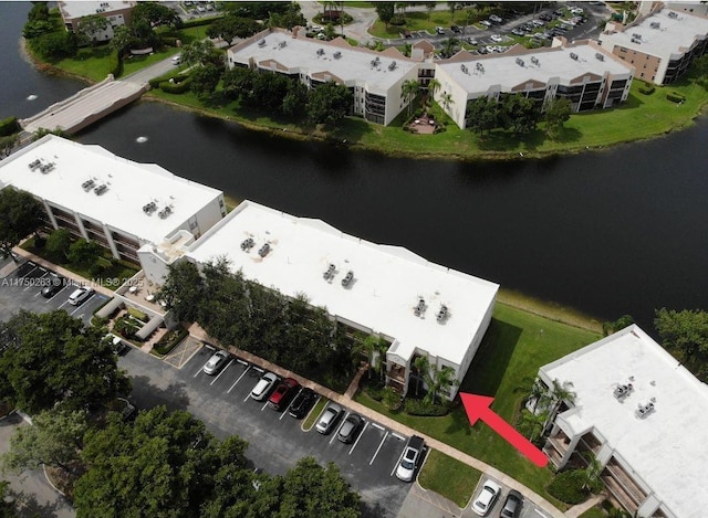 aerial view with a water view and a residential view