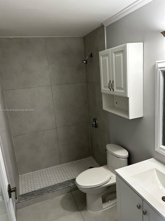 bathroom with a shower stall, toilet, and vanity