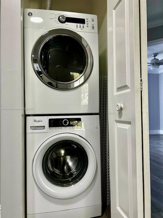 laundry area with stacked washing maching and dryer and laundry area