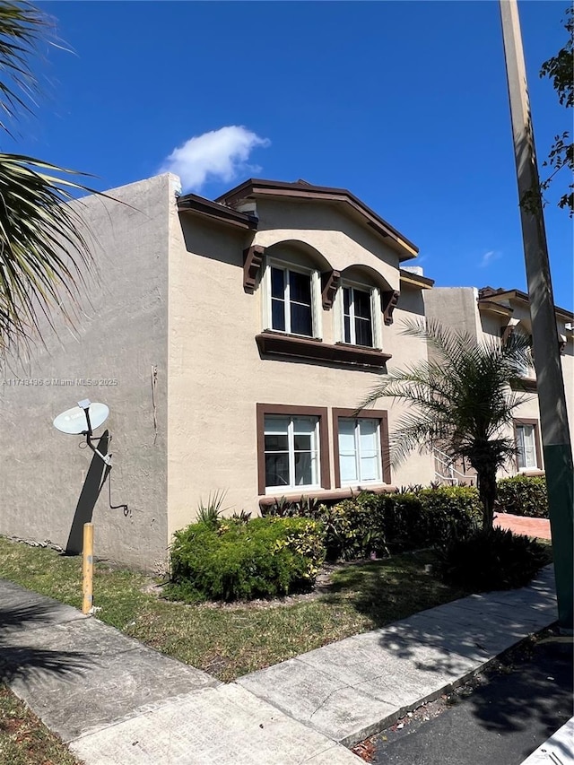 view of home's exterior with stucco siding